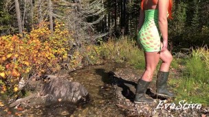 Redhead mom in rubber boots pissing in the stream