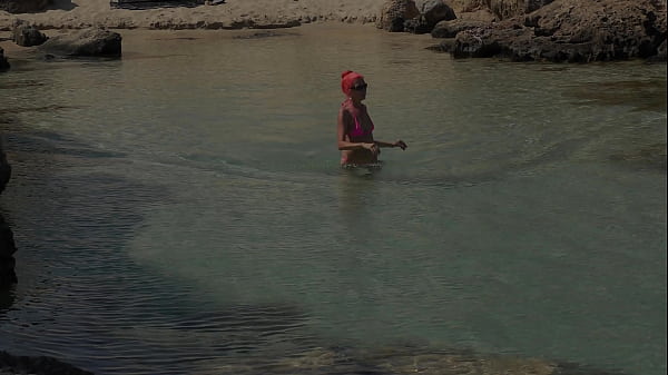 Pink bikini in a beautiful bay